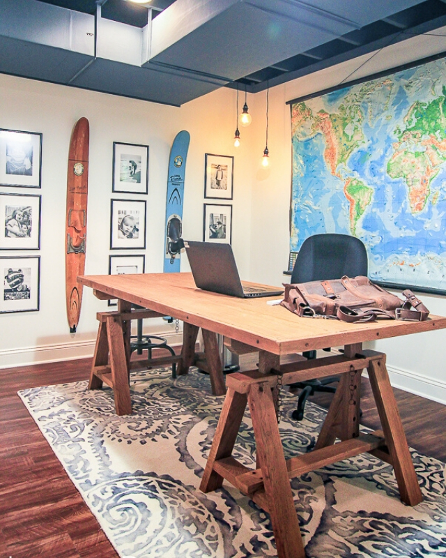 Rustic basement office with wood-look flooring | Design by Philip Gorrivan Design